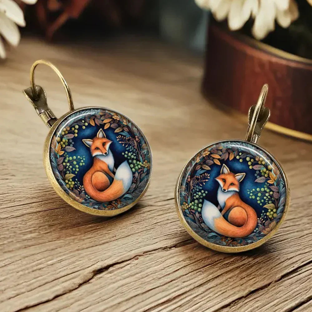 Aretes de vidrio en forma de dome con animales caprichosos