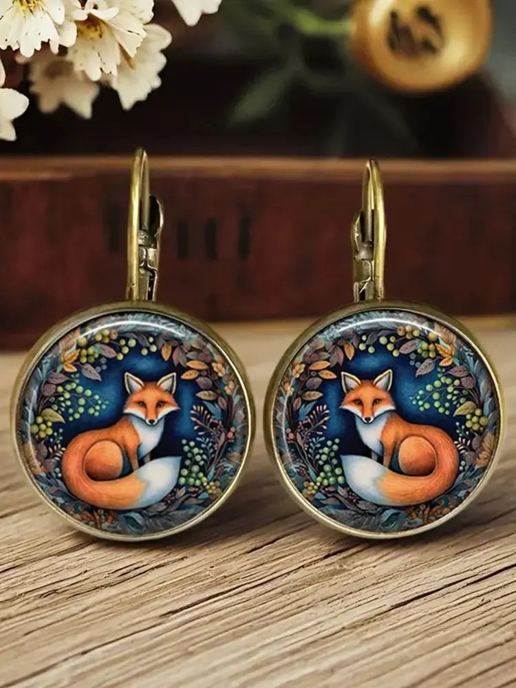 Aretes de vidrio en forma de dome con animales caprichosos