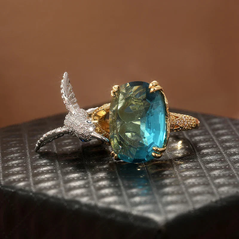 Anillo Ajustable de Colibrí Color Aguamarina – Baño de Oro de 14K