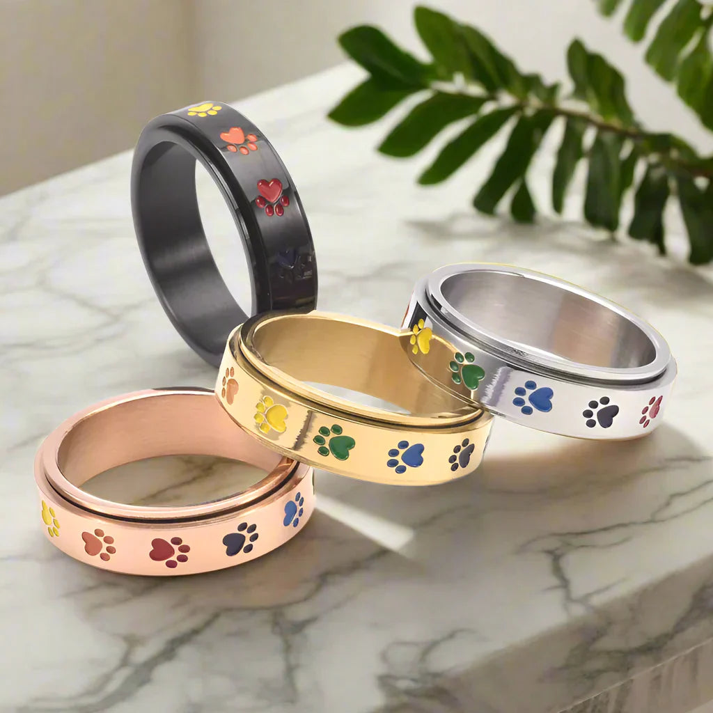Anillo Giratorio Reductor de Estrés – Acero Inoxidable con Huellas Arcoíris