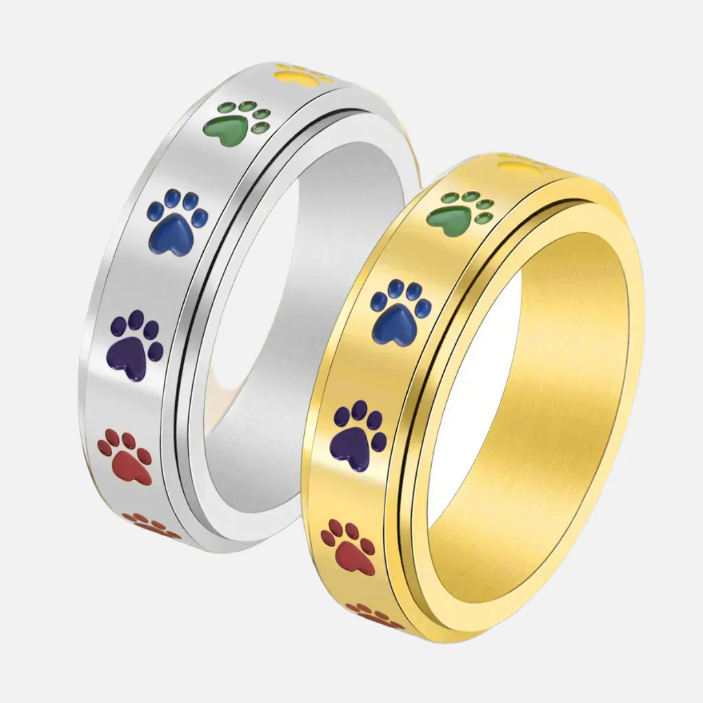 Anillo Giratorio Reductor de Estrés – Acero Inoxidable con Huellas Arcoíris